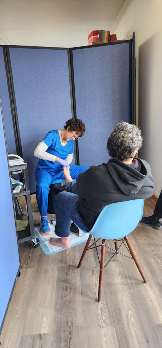 Gail from Firm foundation footcare works on Val’s very sore feet. Val received head to toe treatment.